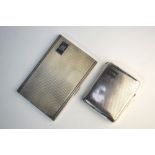 Two engine-turned silver cigarette cases, Birmingham 1933/38, 7.5 oz