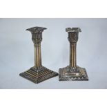 A pair of late Victorian loaded silver short candlesticks with palmate sconces and cluster