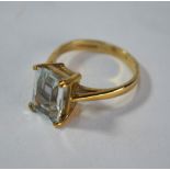 A single stone rectangular pale aquamarine ring, 9ct yellow gold four claw setting, size M 1/2,