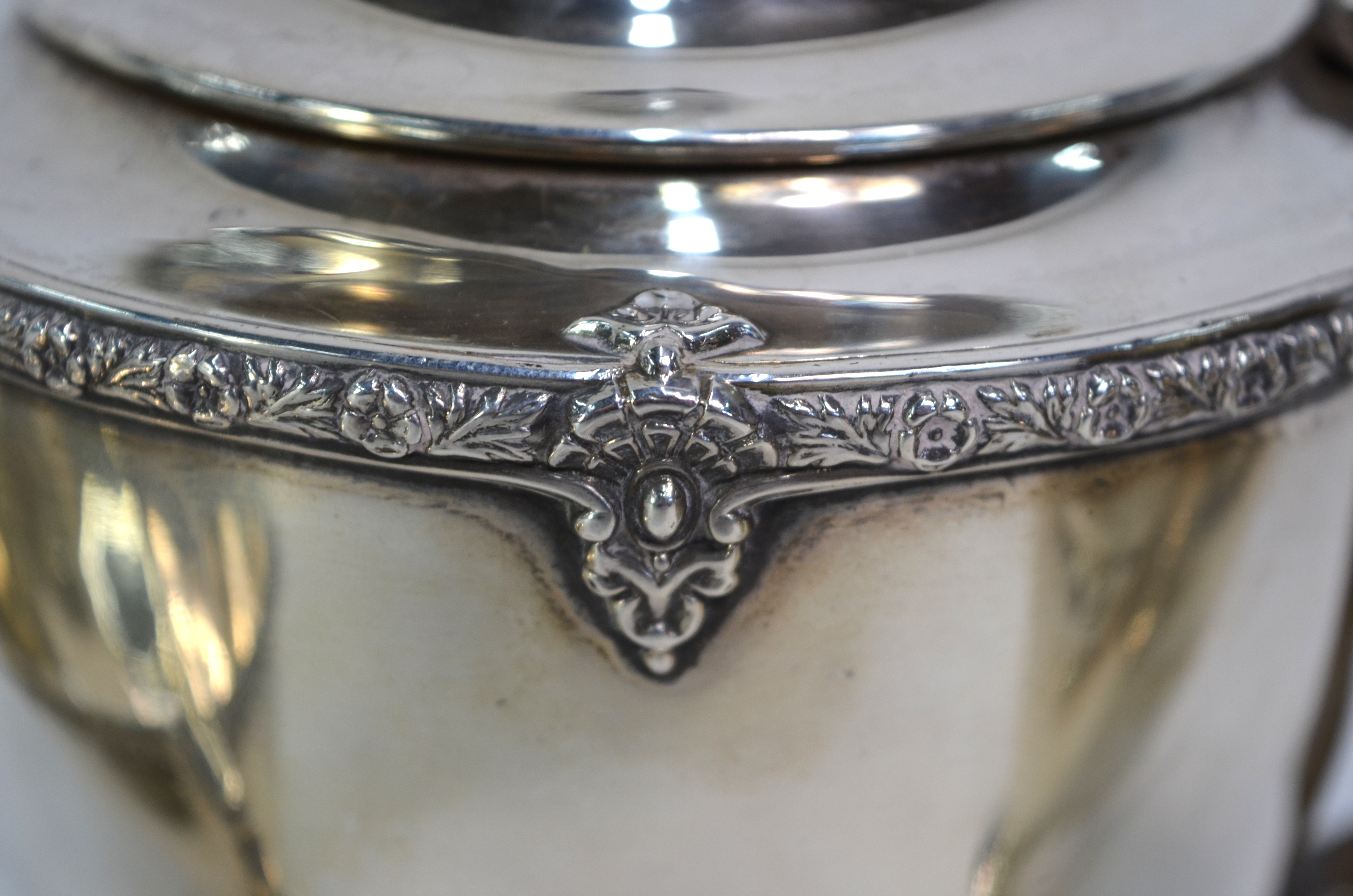 A three-piece silver tea service with floral-cast rim and moulded foot, composite handle and finial, - Image 2 of 5