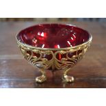 A late 19th century Continental gilt metal Art Nouveau sugar basin with ruby glass liner, with