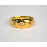 A three-stone gypsy set diamond ring, 18ct yellow gold, size Q, approx 4.2g all in