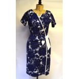 A 1950s Horrockses cotton blue floral print day dress on white ground with attached tie belt and