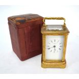 A 19th century English chased brass carriage clock by A B Savory & Sons, Cornhill no 18582 the two