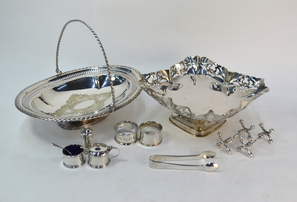 A silver three-piece condiment set with blue glass liners, to/w two silver napkin rings, an epns