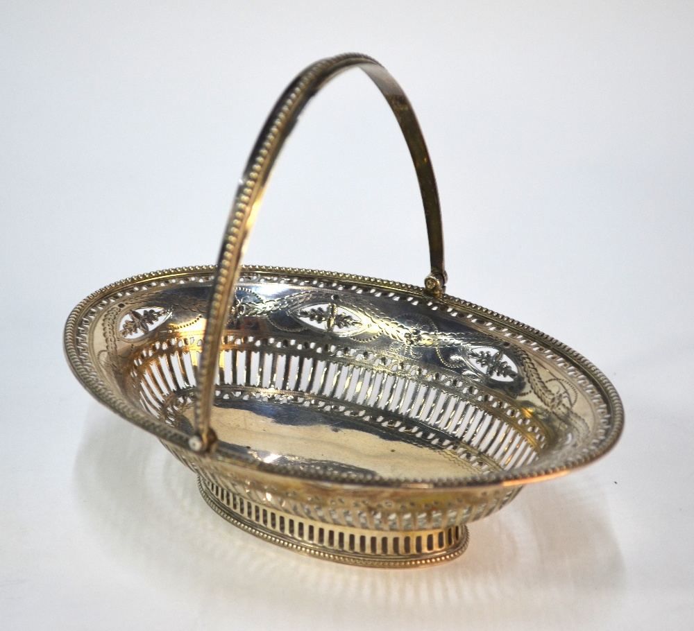 Hester Bateman: an oval pierced bonbon basket in the Adam manner with engraved decoration, beaded