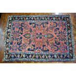 An antique Persian Lilihan rug, salmon ground, 86 x 60 cm