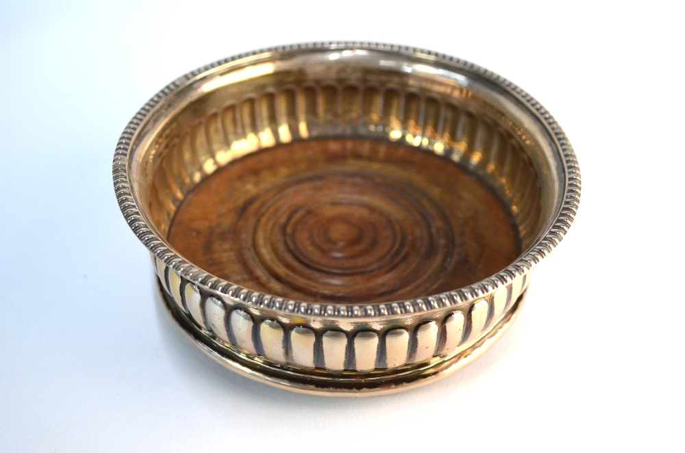 A pair of George III half-reeded silver bottle coaster with egg and dart moulded rims and turned - Image 2 of 6