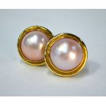 Pair of large mabe pearl earrings of pinkish hue, yellow metal set, for pierced ears