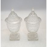 Pair of hobnail cut glass bonboniers raised on a knopped stem on a square star cut base, 24 cm