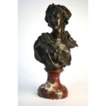 A 19th century bronze bust of a Bacchanalian nymph, raised on a veined rouge marble socle, 31 cm