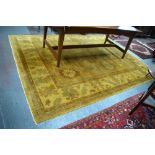 A handmade Agra carpet, gold/yellow ground, 313 x 245 cm [14686]