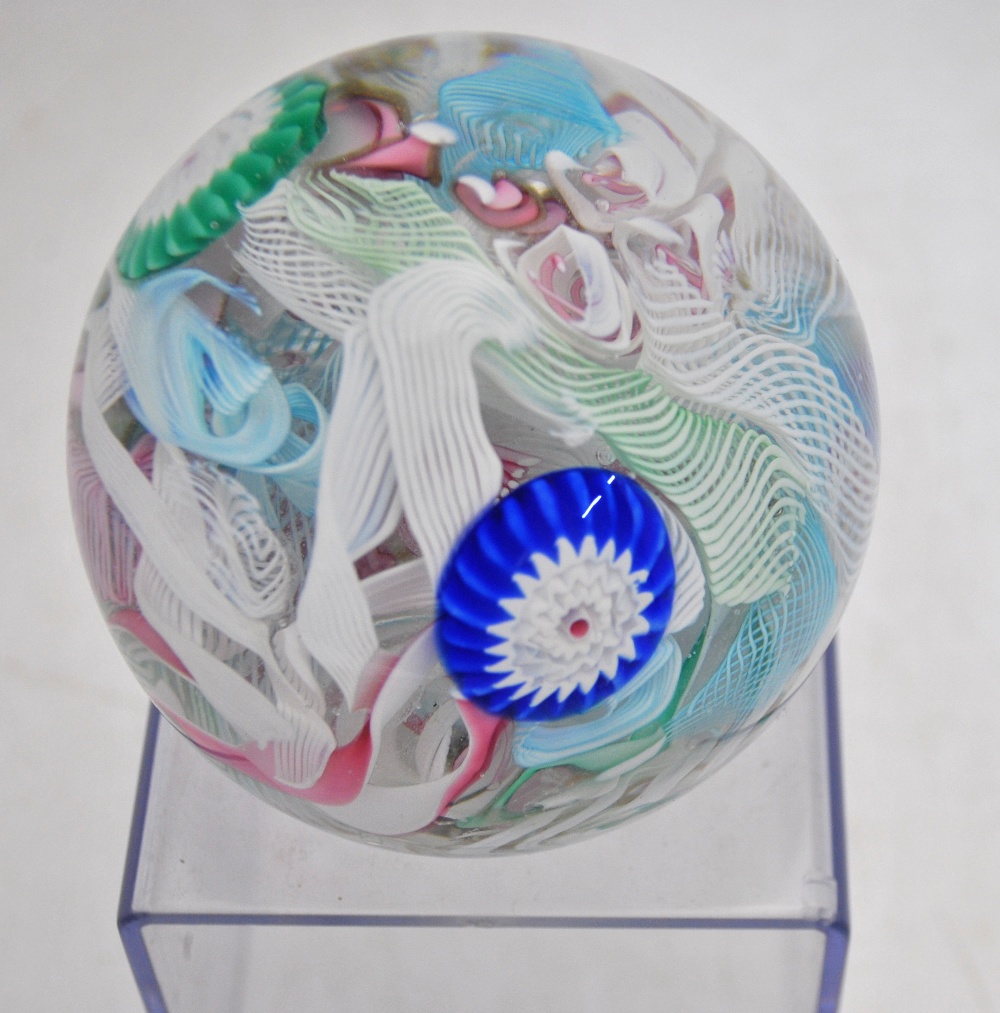 A faceted glass paperweight decorated with a central butterfly cane and concentric bands of canes in - Image 2 of 8