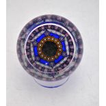 A large Perthshire glass paperweight of complex design with concave top, incorporating a double