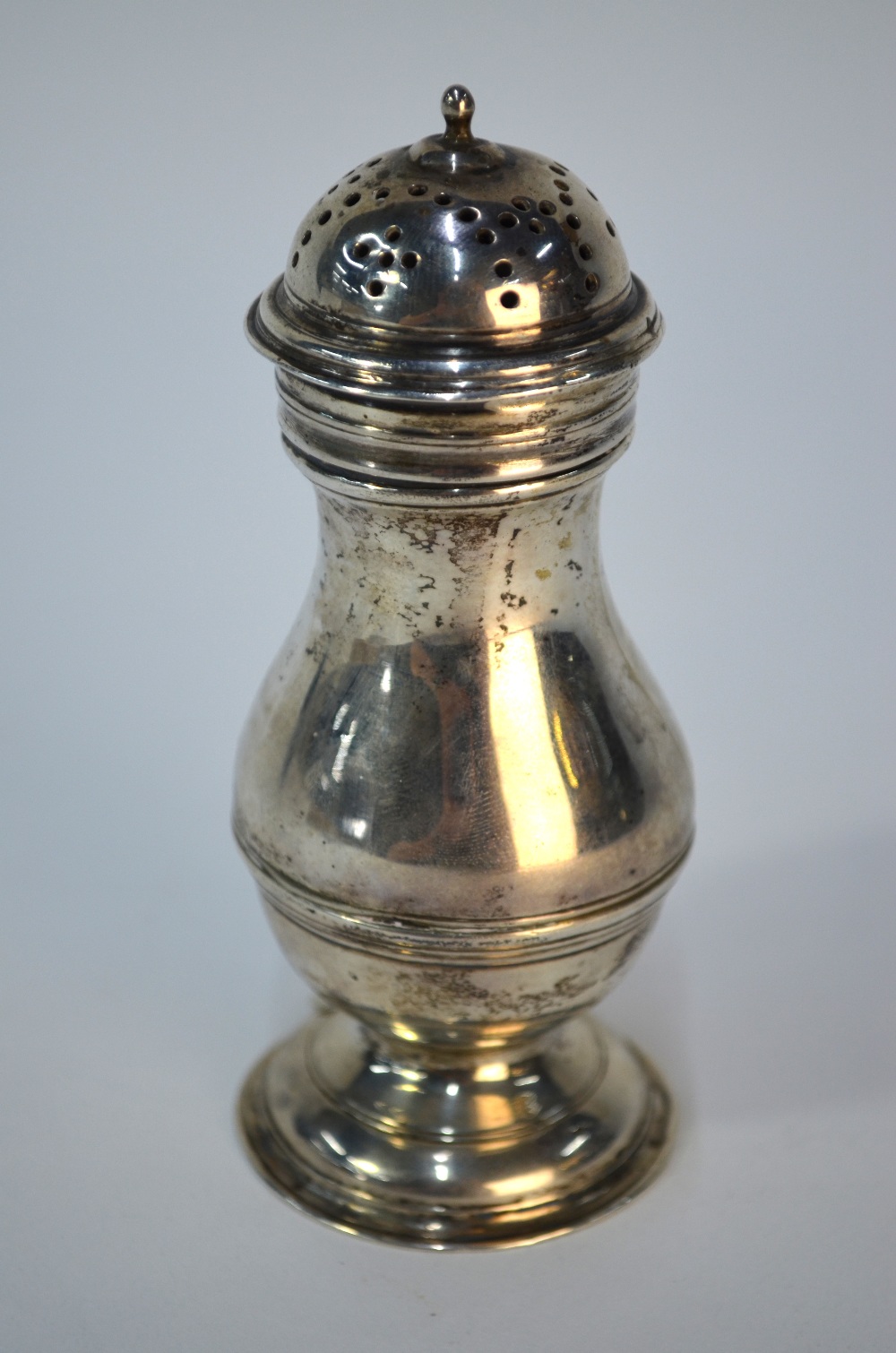 A George II silver baluster muffineer with domed top, Thomas Swift (probably), circa 1750, 12.5 cm