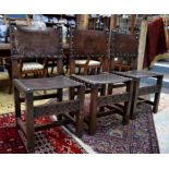 A set of six Victorian jointed oak framed dining side chairs in the Elizabethen style, with brass