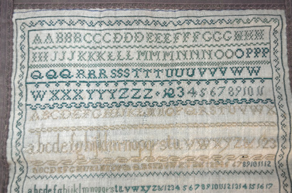 A Victorian alphabet sampler by Emma Crowther, 1842, 31 cm square, unframed and mounted on a green - Image 3 of 4