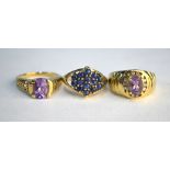 A cabochon sapphire cluster ring, 9ct yellow gold set with split shoulders to/w single stone oval