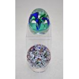 Two Paul Ysart paperweights of 'Fountain' design, one with internal loops of blue and green with