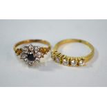 A sapphire and cubic zirconia cluster ring, 9ct yellow gold claw set, size K 1/2 to/w five stone