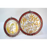 Two circular stained glass leaded panels, painted with birds in the Aesthetic style, 27 cm and 18 cm