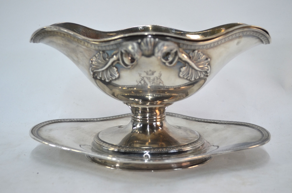 A French 950 grade double-lipped sauce boat with loose liner, foliate and scroll cast and chased