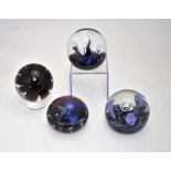 Four Caithness glass paperweights:  Tropicana, limited edition 178/500, 1975; Paperweight with