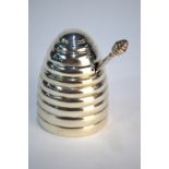 A modern silver beehive honeypot in the form of a skep, with original spoon, maker CH, Birmingham