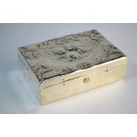A late Victorian silver stamp-box, embossed with winged cherub heads, ebony lining with curved