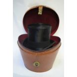 A vintage black silk top hat retailed by Alf & Pellett Ltd., Cross St and Royal Exchange,