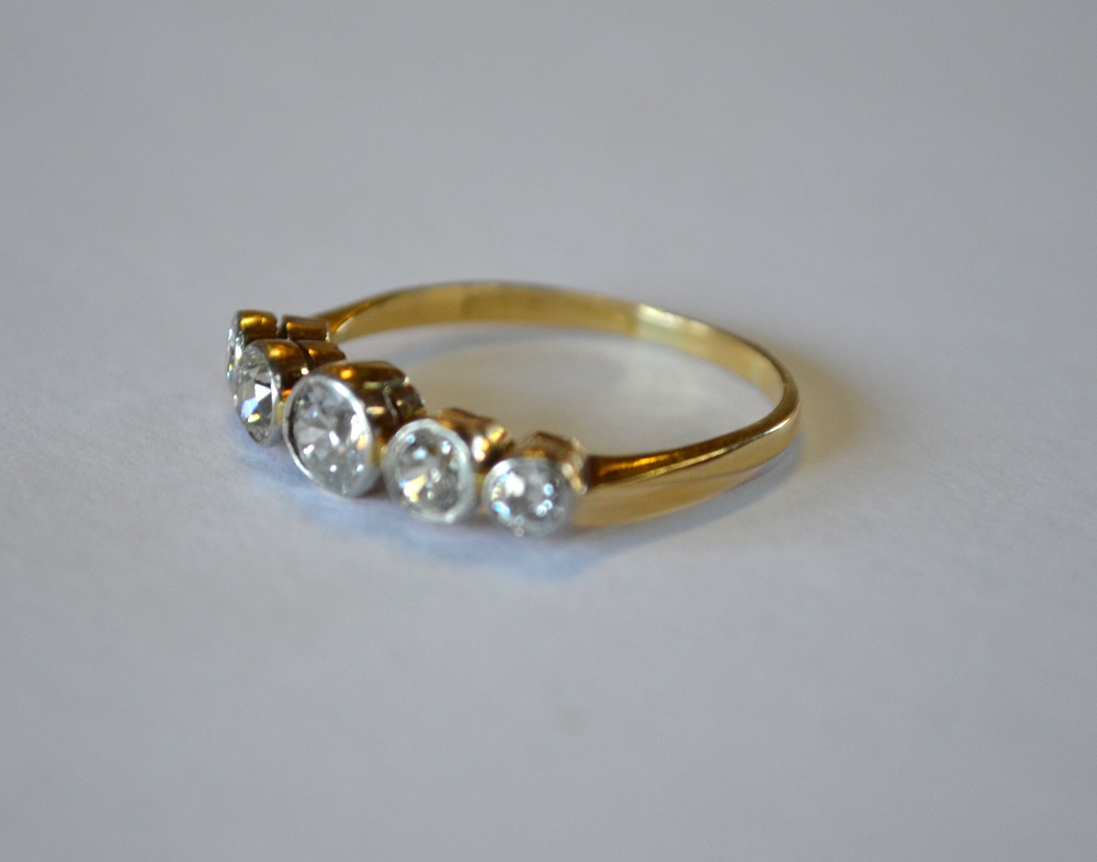 A five stone old cut diamond ring, yellow and white metal collet setting, stamped 18ct, size R,