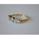 A five stone old cut diamond ring, yellow and white metal collet setting, stamped 18ct, size R,