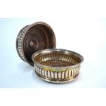 A pair of George III half-reeded silver bottle coaster with egg and dart moulded rims and turned