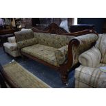 A Regency mahogany framed sofa with scroll ends, raised on turned legs to ceramic castors, 200 cm