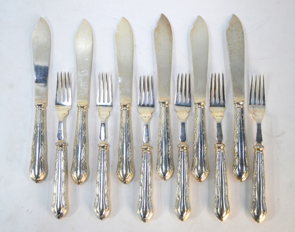 A set of six each silver fish knives and forks with unmarked loaded handles, the blades Walker &