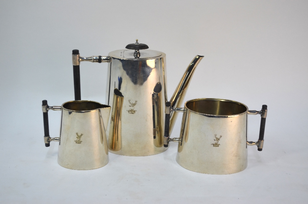 A late 19th century electroplated three-piece coffee service of oval tapering form, the ebony-rod