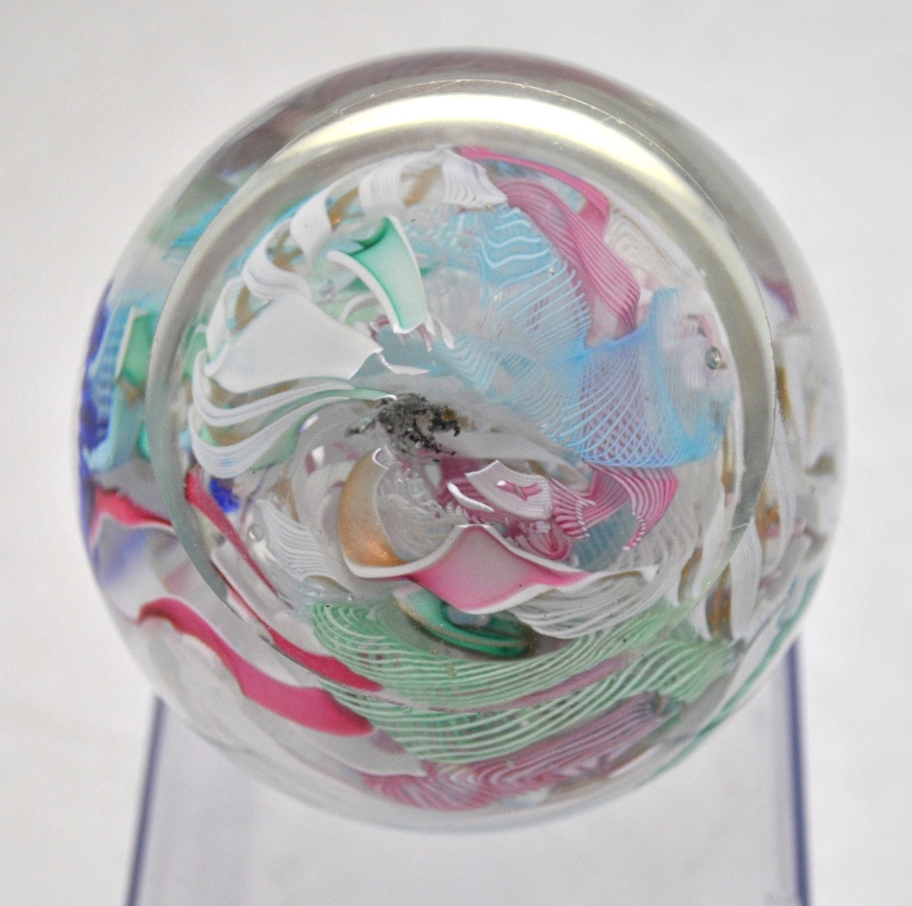 A faceted glass paperweight decorated with a central butterfly cane and concentric bands of canes in - Image 3 of 8
