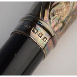 An orchestral conductor's baton, ebonised and with embossed and chased silver mounts, Ebenezer