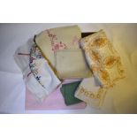 Two boxes of assorted table linen to include tablecloths, napkin sets, doilys etc.