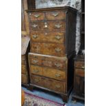 An 18th century feather-banded walnut chest on chest, two short over three long graduated drawers