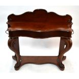 A Victorian mahogany serpentine form hall stand with moulded shaped gallery back over a centre