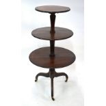 A Victorian mahogany three graduated drop leaf tier dumb waiter, on tripod base to brass castors, 62