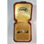 A single stone old cut diamond ring, approx 0.50 carats, in worn white metal claw setting, stamped