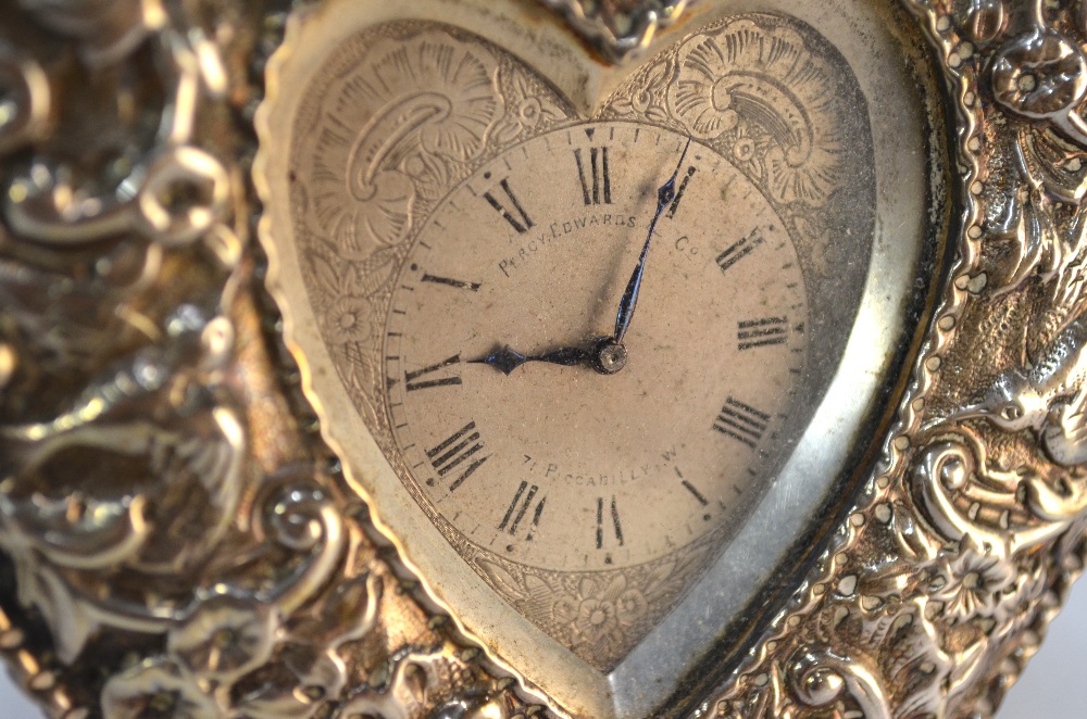 A Victorian embossed silver heart-shaped strut clock with engraved dial and Swiss movement, retailed - Image 6 of 7