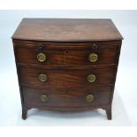 A Victorian mahogany bowfront chest of three long graduated drawers beneath a full width brush