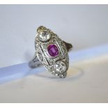 An Art Deco pink sapphire and diamond marquise shaped cluster ring, white metal millgrain setting,