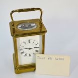 A French brass carriage clock, the eight-day two train movement by H Jacot no 16999 striking the