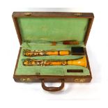 A vintage Crofton amber-coloured clarinet with gilt mounts by John E Dallas & Sons Ltd, London, in