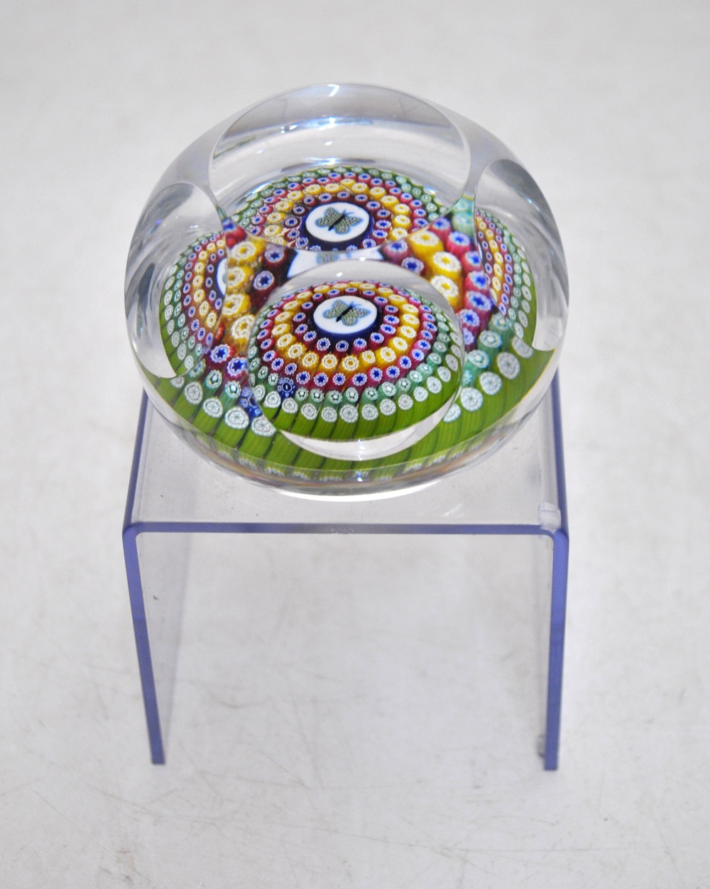 A faceted glass paperweight decorated with a central butterfly cane and concentric bands of canes in - Image 5 of 8