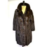 A dark brown mink coat with hook and loop fastening (six false buttons), 56 cm across chest with